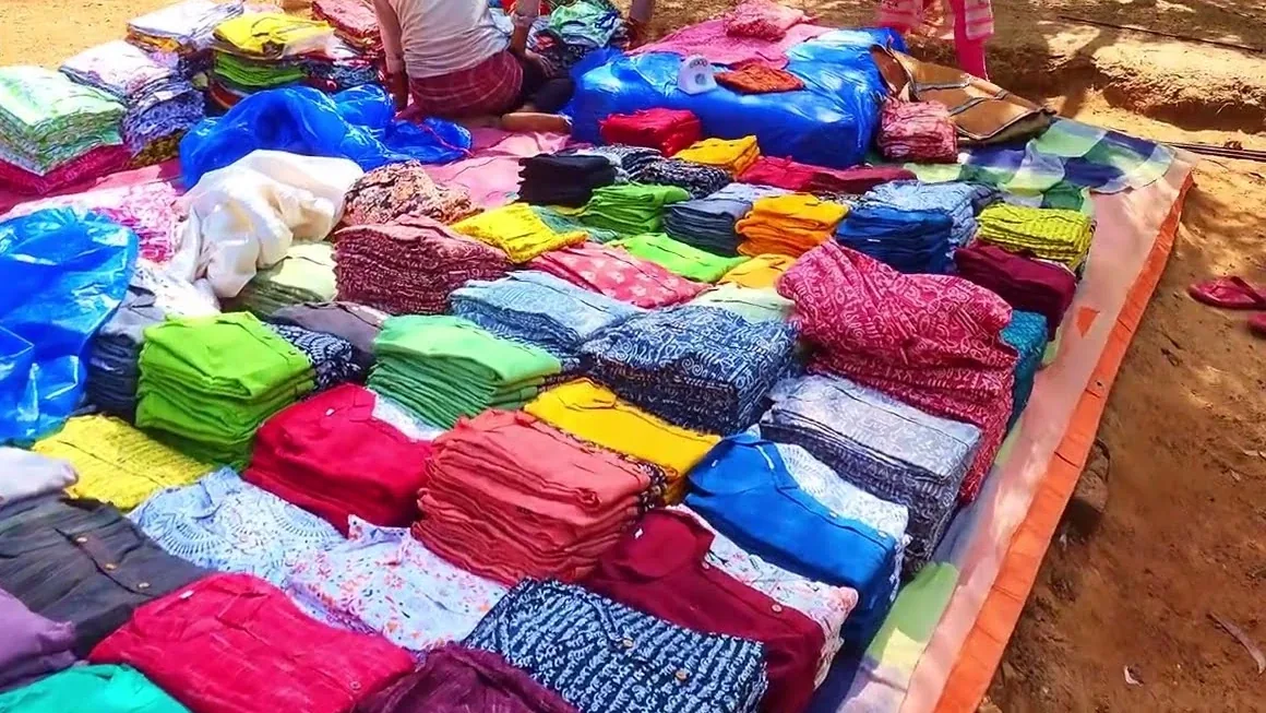 Textiles laid out for sale at the Sonajhuri haat near Shantiniketan